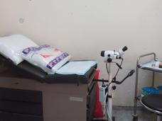 Photo of an exam table inside small clinic room in Nigeria