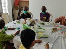 Children doing arts and crafts around a table