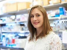 Photo of Dr. Ashley Laughney standing in a laboratory