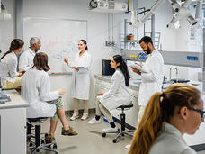Group of scientists having a meeting in a laboratory