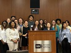 Active and transitioning iCURE Scholars pose as a group during the 2023 iCURE Year-End Gathering.