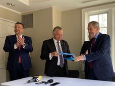 President of Costa Rica, Rodrigo Chaves Robles,  Arnoldo André-Tinoco, Costa Rica Minister for Foreign Affairs, Doug Lowy, M.D., NCI Principal Deputy Director. Shake hands after signing MOU. 