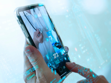 hands holding a cell phone that has a doctor on it, with decorative numbers and data in the foreground