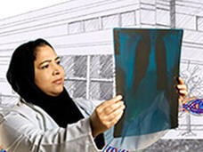 Female researcher holds and studies an x-ray picture