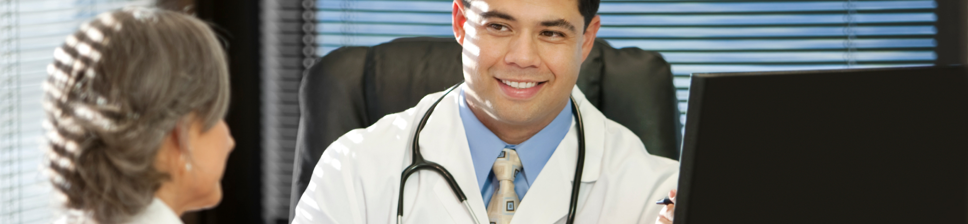 Doctor and patient sitting at desk