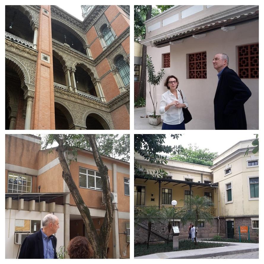 Four-panel photo collage of a visit to FIOCRUZ campus with Dr. Beatriz Grinsztejn as guide. Top left: Interior architecture showing ornate brick building with decorative arches and columns. Top right: Dr. Grinsztejn speaking with Dr. Ted Trimble outside a building with decorative lattice windows. Bottom left: Dr. Ted Trimble viewing another campus building with trees in the foreground. Bottom right: View of a historic building on campus with stairs leading to an entrance where people in white coats can be s