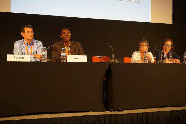 Dr. Sandy Dawsey and Dr. Michael Mwachiro discussing their mentor-mentee experience in a research grant program session.