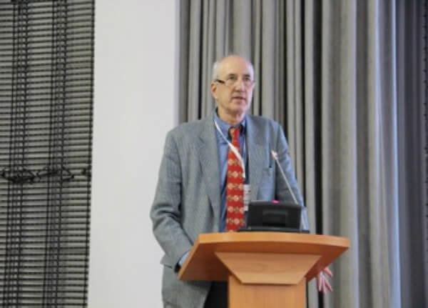 Ted Trimble presenting behind a podium.