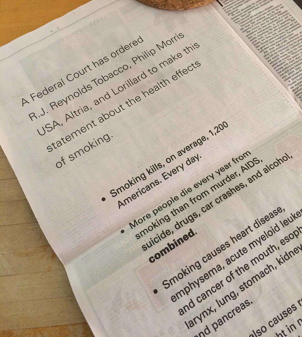A photo of a newspaper page with text that includes a court ordered statement from major tobacco companies along statistics abou the negative health impacts of smoking.