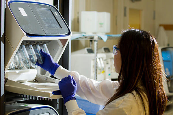 Female technician in a lab conducting research