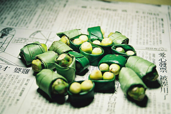 Areca nuts wrapped in betal leaves.