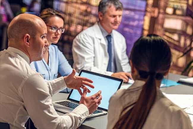Group of scientists having a meeting