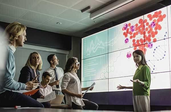 Group of people talking during a presentation