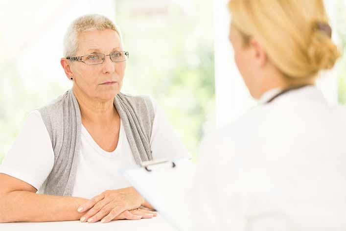 Senior caucasian female patient listening to female doctor