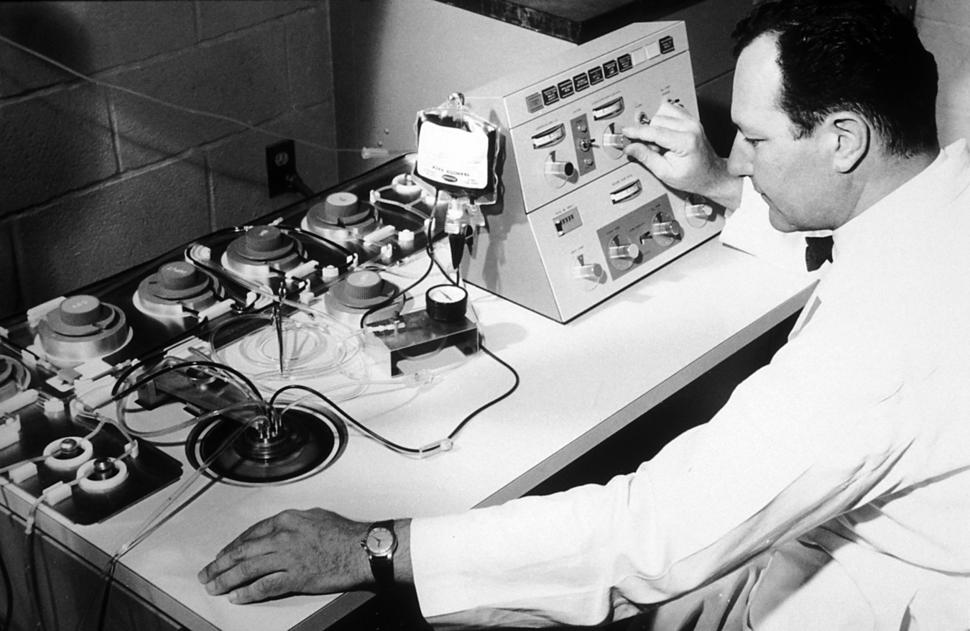 Emil Freireich working with a blood cell separator at MD Anderson Cancer Center.
