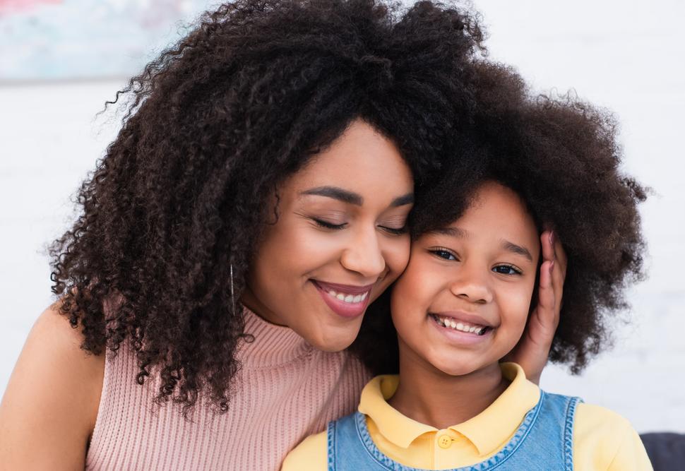 Image of smiling African American mother and child.