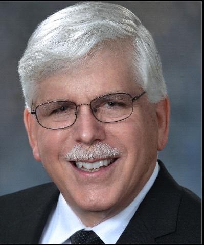 Headshot of white male with glasses and gray hair