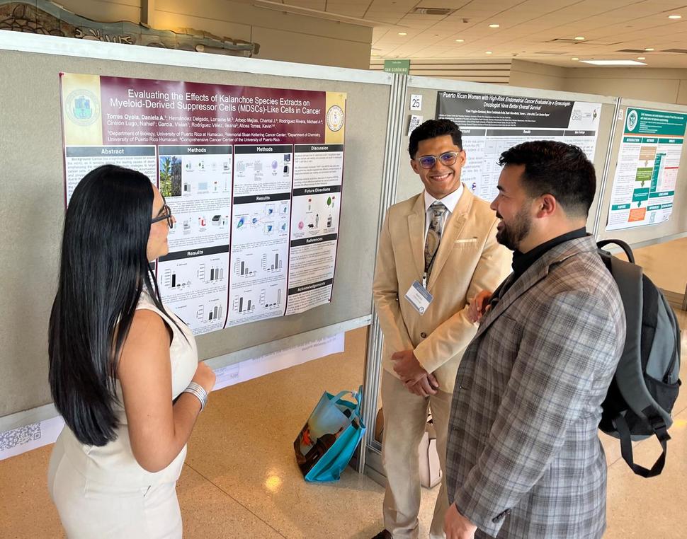Puerto Rico PDW Participants present their research during the poster session.