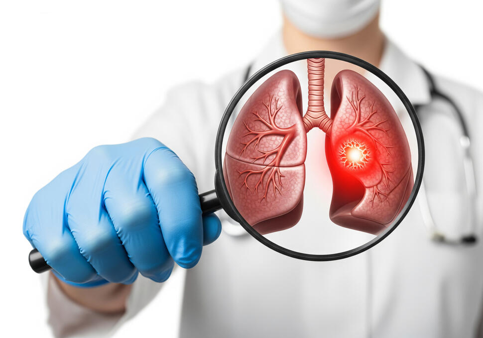A health care provider holds a magnifying glass over a lung illustration, highlighting a bright red abnormal area in one lung.