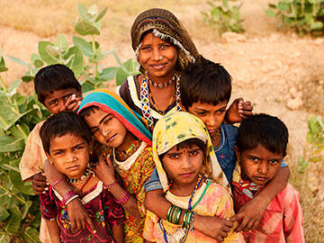 A group of Indian children wearing brightly colored clothing.