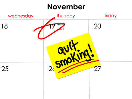 Photo of November calendar with the date 19 circled and "Quit Smoking" written on a yellow sticky note.