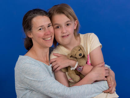 Kristina hugging her daughter Jane who was treated with selumetinib.