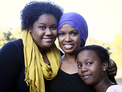 Mother in Headscarf Standing with Daughters