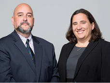 Jean-Claude Zenklusen, Ph.D., and Carolyn Hutter, Ph.D standing together for a picture.