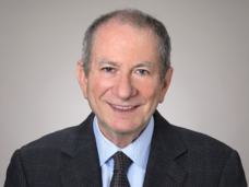 Professional headshot of Eric "Rocky" Feuer