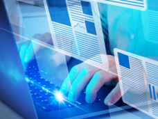 Image of a person typing on a laptop with article icons superimposed in the foreground.