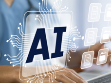 A person wearing a stethoscope sits at a lap top computer. Above the keyboard are a number of small icons and dotted lines, signifying artificial intelligence. The letters "AI" appear just above the keyboard.