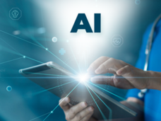 A person wearing a stethoscope holds a tablet with one hand and presses the screen with the other. The letters A-I are illuminated above the screen, depicting how doctors and researchers are using AI to address today’s biomedical issues.
