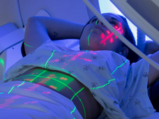 Person receiving radiation therapy treatment.
