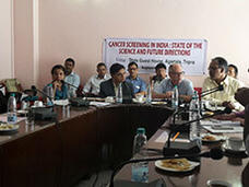 A group of people sitting at a conference table.