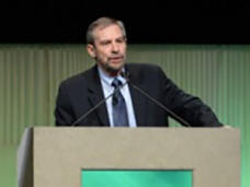 Dr. Lowy speaks from an AACR lectern