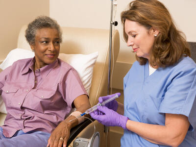 Nurse giving a patient an injection. 