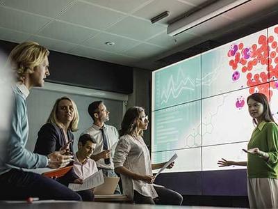 Group of people talking during a presentation