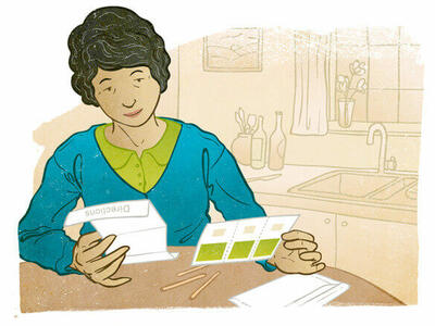 Illustration of a person reading directions at a table in a kitchen.