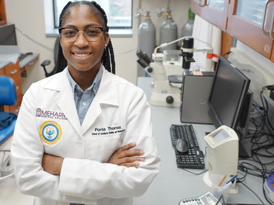 Photo of Dr. Portia Thomas standing in her laboratory