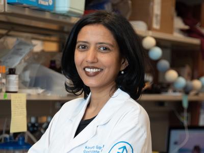 Photo of Dr. Karuna Ganesh standing in her laboratory