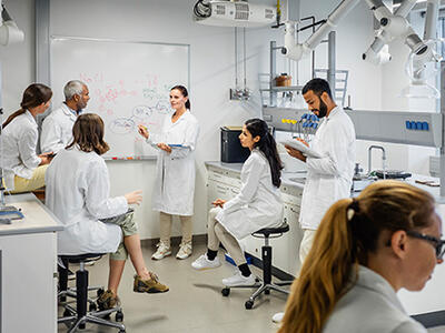 Group of scientists having a meeting in a laboratory
