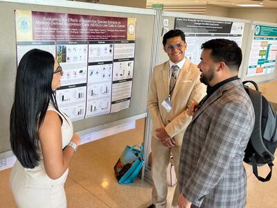 Puerto Rico PDW Participants present their research during the poster session.