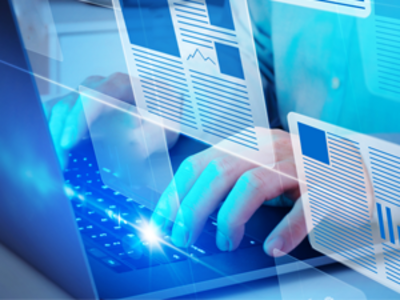 Image of a person typing on a laptop with article icons superimposed in the foreground.