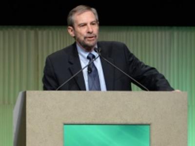 Dr. Lowy speaks from an AACR lectern