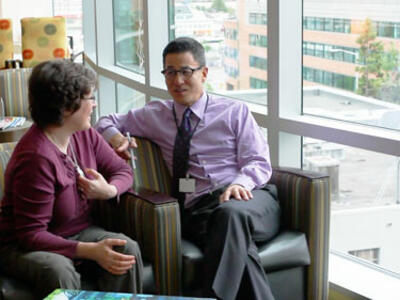 Dr. Anthony Back talking with one of his patients