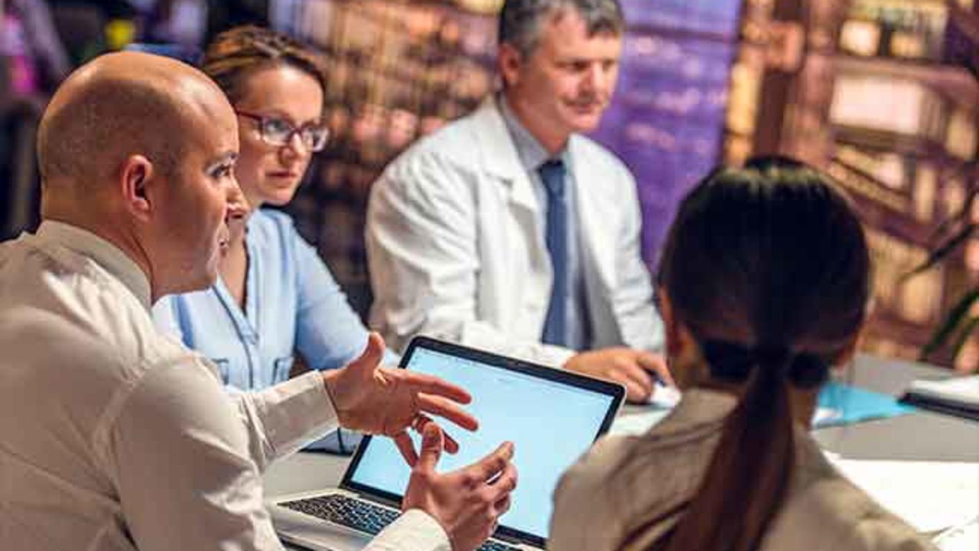 Group of scientists having a meeting