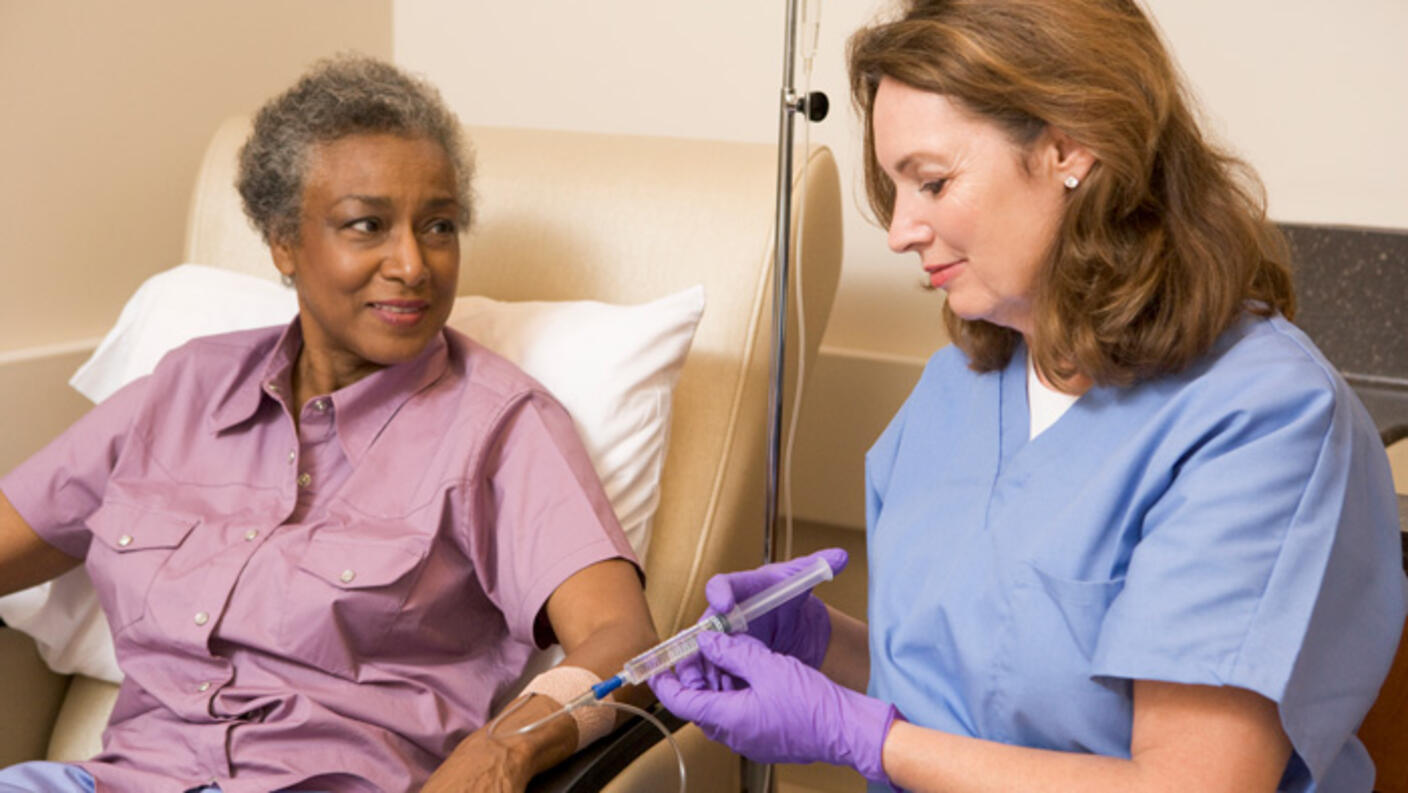 Nurse giving a patient an injection. 