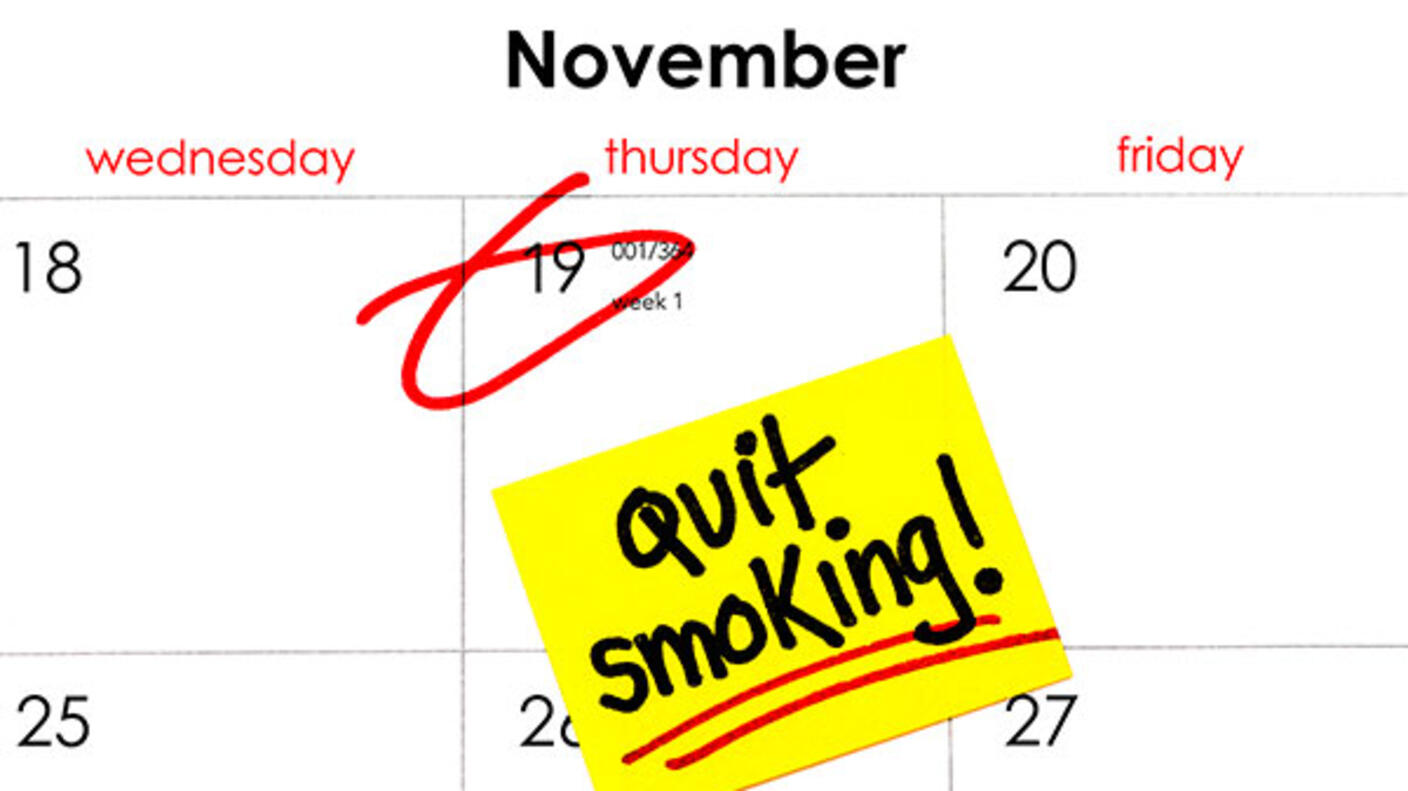 Photo of November calendar with the date 19 circled and "Quit Smoking" written on a yellow sticky note.