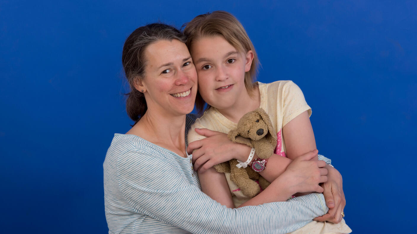 Kristina hugging her daughter Jane who was treated with selumetinib.