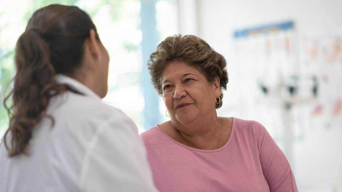 Doctor talking to Hispanic patient